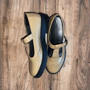 Wing tip Mary Janes.